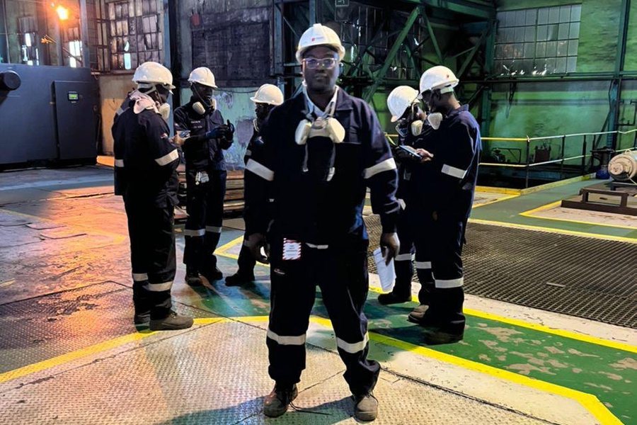 Site crew during a safety briefing inside a processing plant