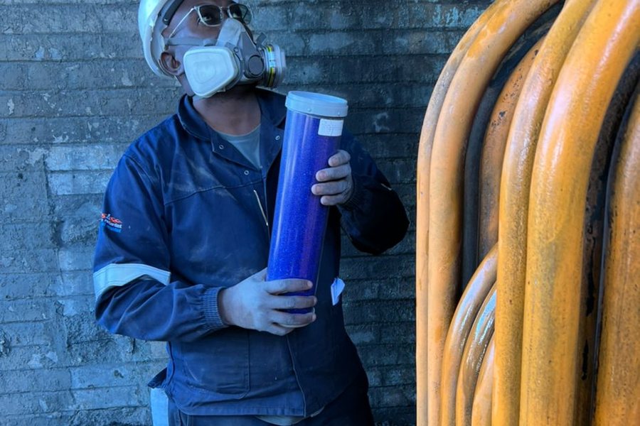 Technician handling insulation material at a process plant